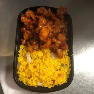 a tray of rice and meat