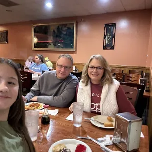 a family sitting at a table
