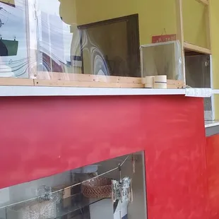 a red counter and a yellow wall