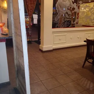 a dining room with a table and chairs