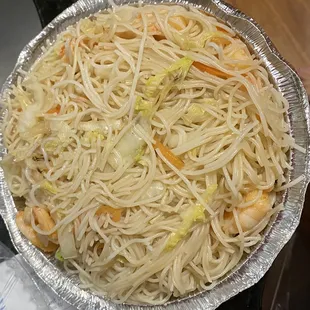 a plate of noodles and shrimp