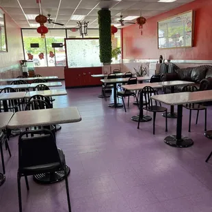 empty tables and chairs in a restaurant