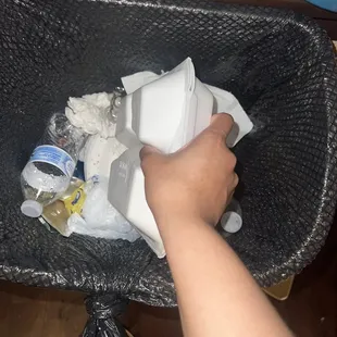 a person holding a wii remote in a basket