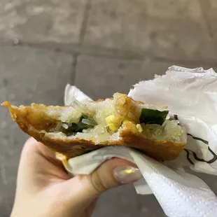  person holding a piece of food