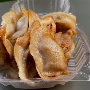 Pan fried pork dumplings. $3