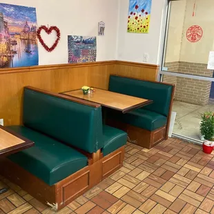 a booth with two tables and a bench