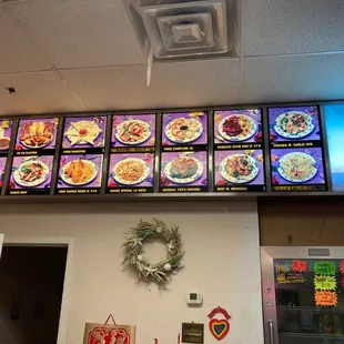 menus on the wall of a chinese restaurant