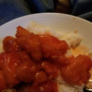 a plate of food with rice and meat