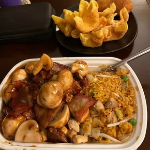 Pork and Mushroom Dinner Meal, with extra sides of Crab Rangoon also appearing in photo.