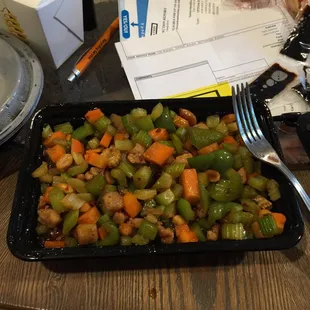 This was supposed to be "Kung Pao Chicken". Instead it was 10 pieces of small bland chicken in a container of vegetables and brown water.