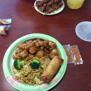 Orang chicken combo with lo mein, chicken on a stick, egg drop soup