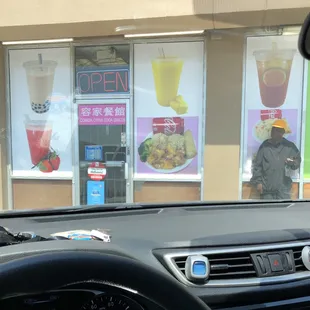 a man standing in front of a fast food restaurant