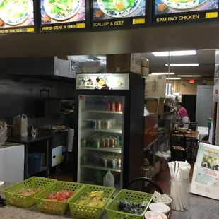 a restaurant counter with food and menus