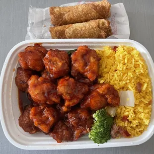 General Tso chicken with fried rice and egg rolls.