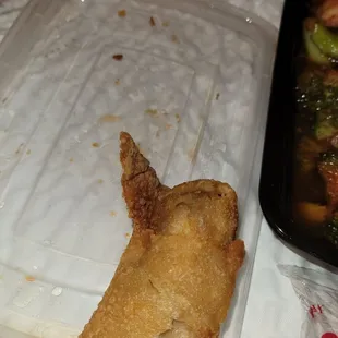 a plate of food and a plastic container of food