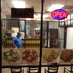 a man in a blue shirt in a restaurant