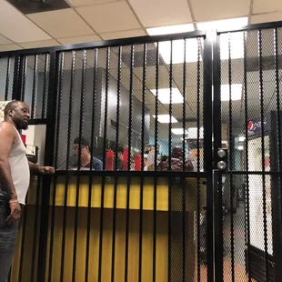 a man standing in a jail cell