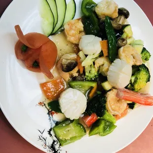 a plate of vegetables and shrimp