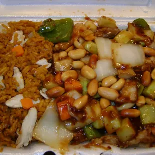 a takeout container with rice, beans, and vegetables