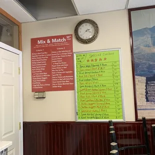 a menu and a clock on the wall