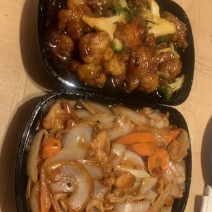 two trays of food on a table