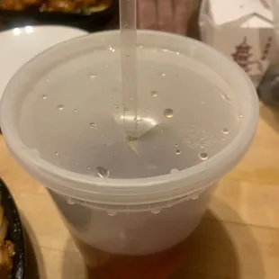 a plastic cup filled with liquid