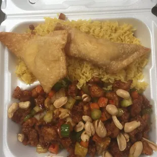 a takeout container with rice, meat and vegetables