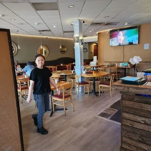 a woman standing in a restaurant