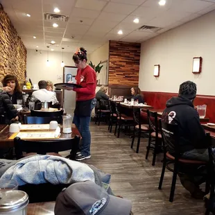 Server and customers enjoying their day.