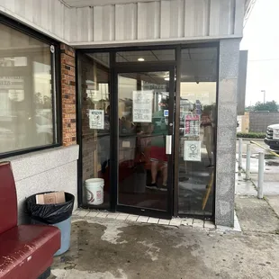 The front door. Notice the signs!!! Service dogs allowed. Only until someone arrives with one