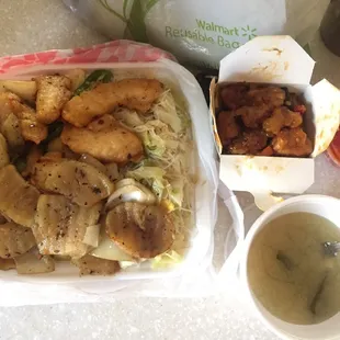 a tray of food and a cup of soup