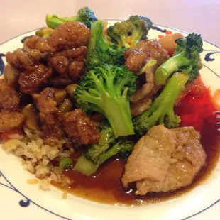 Buffet broccoli and beef with fried rice and noodles.