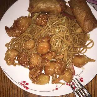 Food is delicious this is low mein Egg rolls and Seseme chicken