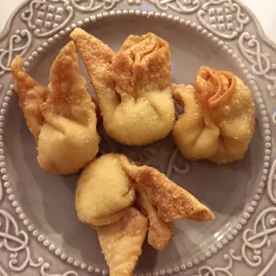 Cream cheese wontons actually filled with a LOT of cream cheese, unlike most places that skimp on it!