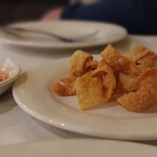 When you sit down they bring you wonton strips with sweet n&apos; sour sauce.  They&apos;re addictive.   It&apos;s  such a nice touch that they do this.