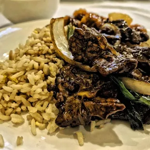 a plate of meat and rice