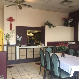a dining area with tables and chairs