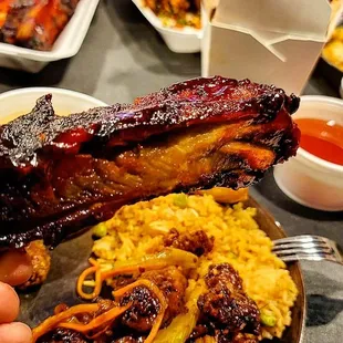 a plate of ribs and rice