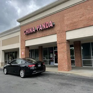 a car parked in front of the store
