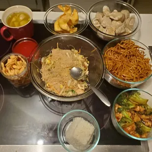 various bowls of food on a stovetop