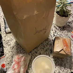 Delivery bag, wonton soup, Chicken Lo Mein, egg rolls