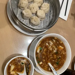 a bowl of soup and a bowl of dumplings