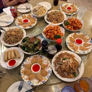 spicy orange chicken, fried shrimp, pan fried noodle (shrimp), beef broccoli, beef fried rice, and egg rolls
