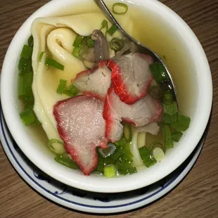 a bowl of soup with meat and vegetables