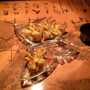 a plate of wontons on a table