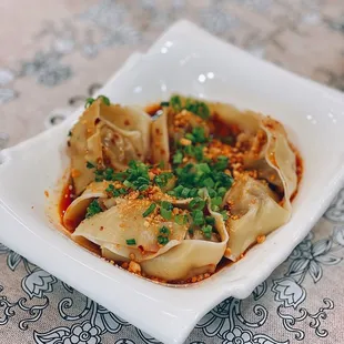 a plate of dumplings on a table