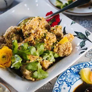 a plate of food with rice and vegetables