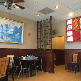 a dining area with tables and chairs