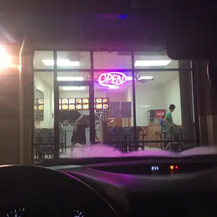 a neon sign in the window