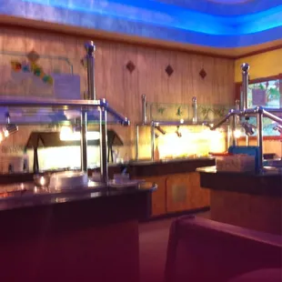 a buffet area with a variety of food items